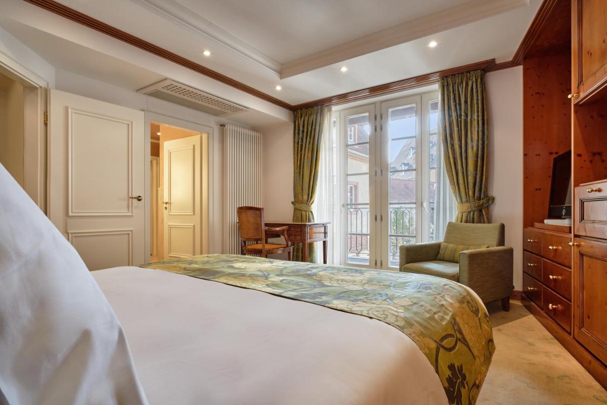 Un ou plusieurs lits dans un hébergement de l'établissement Hotel & Spa A la cour d'Alsace by HappyCulture