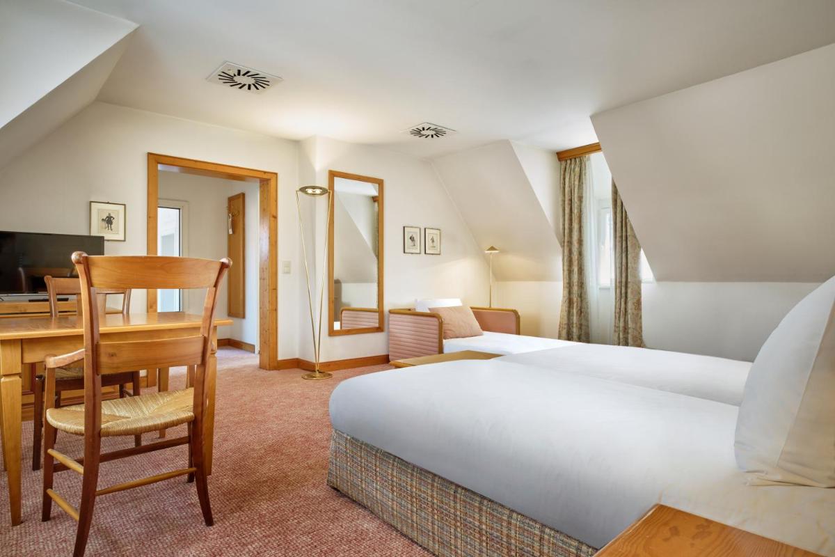 Un ou plusieurs lits dans un hébergement de l'établissement Hotel & Spa A la cour d'Alsace by HappyCulture
