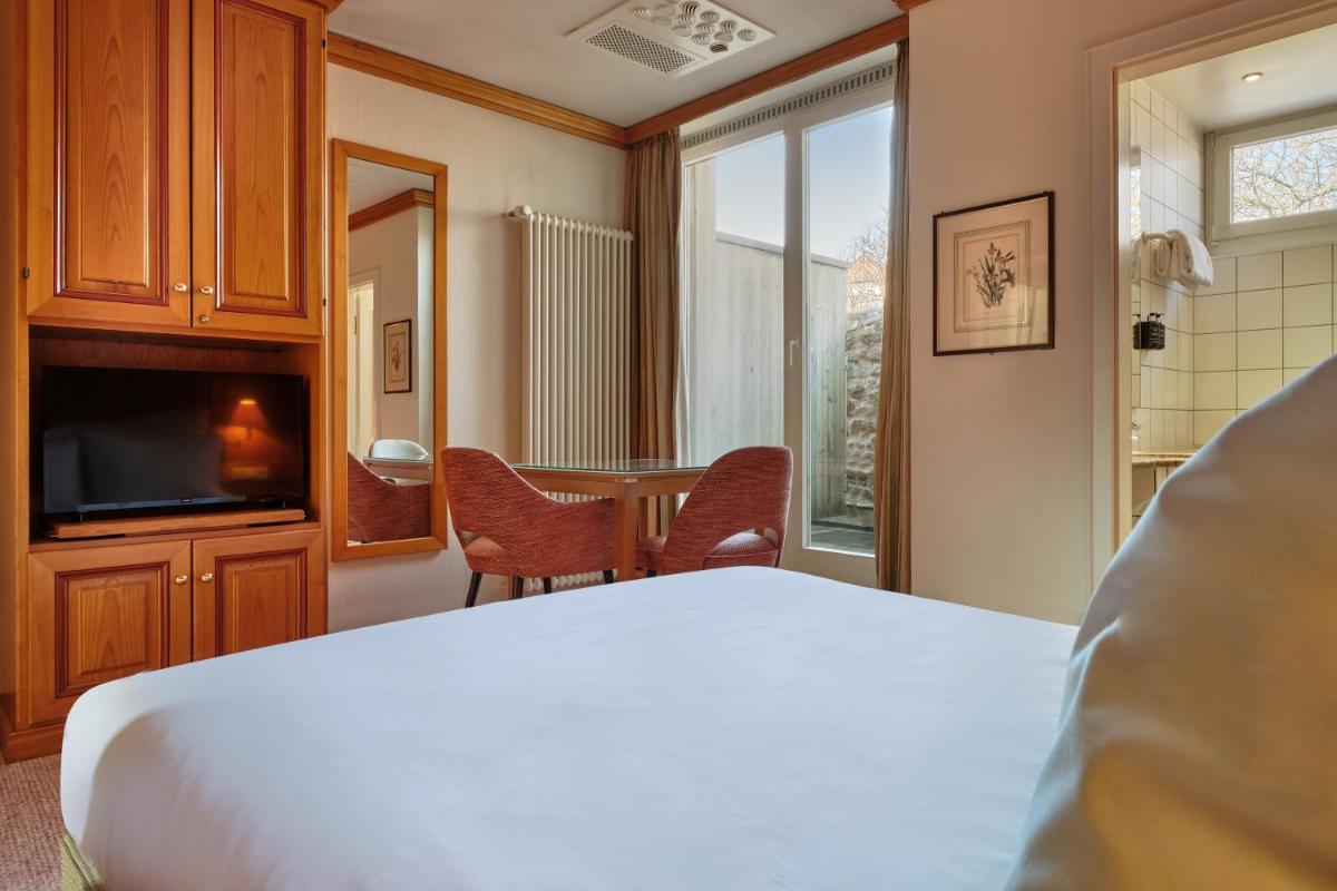 Un ou plusieurs lits dans un hébergement de l'établissement Hotel & Spa A la cour d'Alsace by HappyCulture