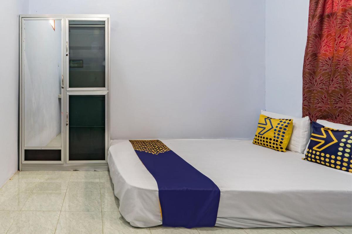 SPOT ON 93966 Dhiya Guest House Syariah - Housity