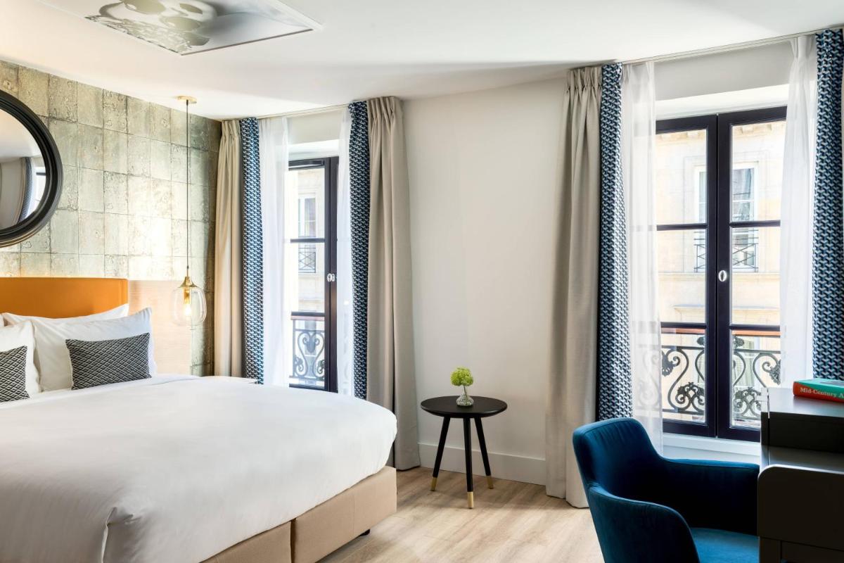 Un ou plusieurs lits dans un hébergement de l'établissement Renaissance Paris Vendome Hotel