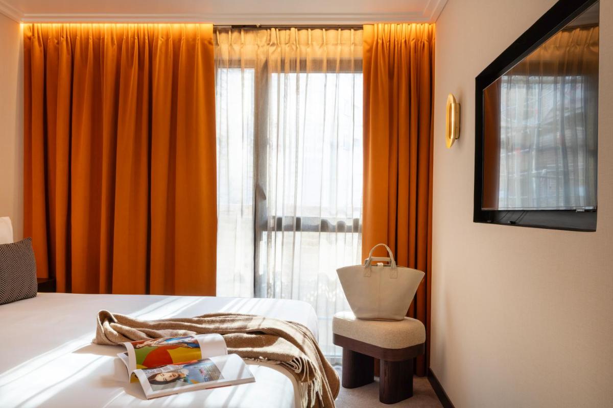 Un ou plusieurs lits dans un hébergement de l'établissement Belinda Hôtel & Spa