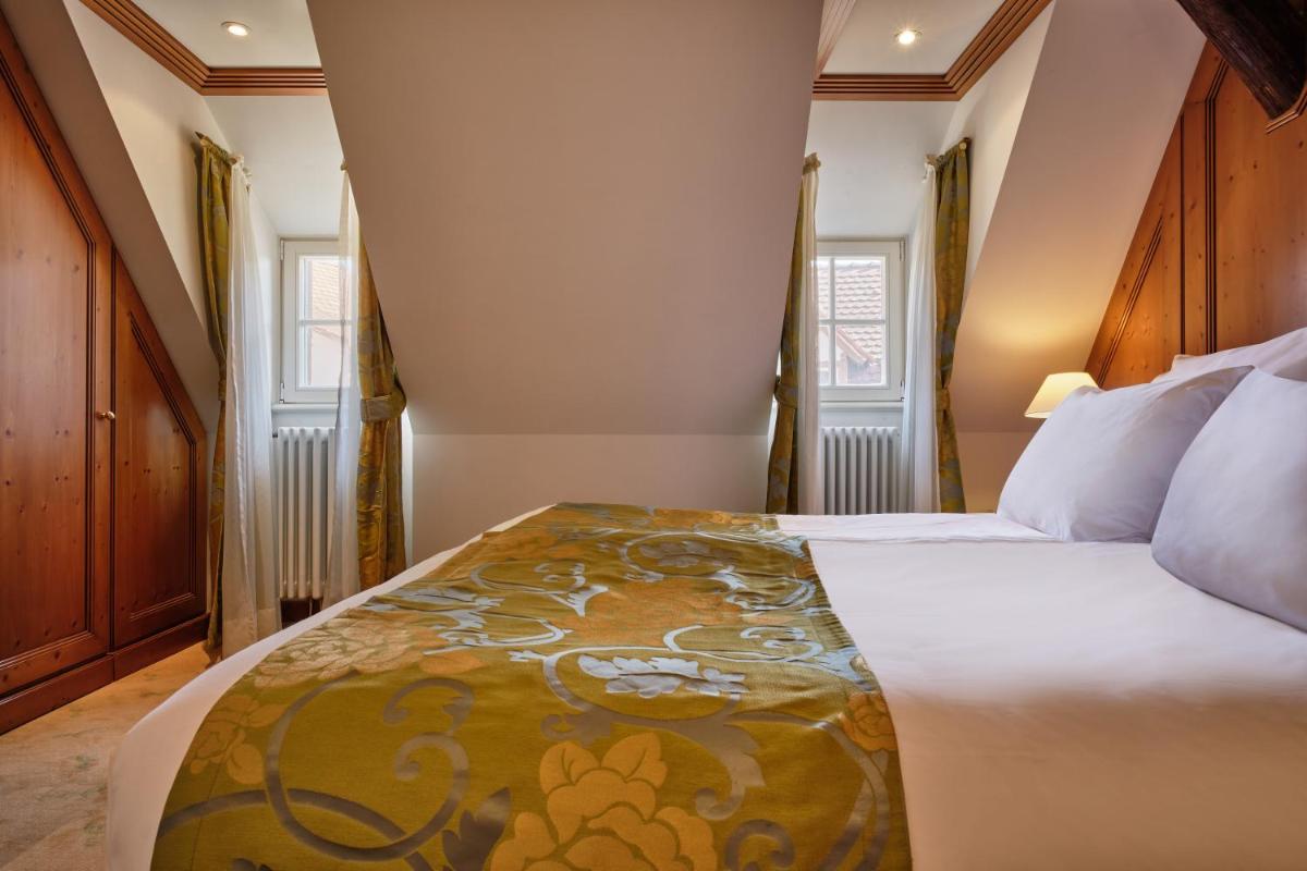 Un ou plusieurs lits dans un hébergement de l'établissement Hotel & Spa A la cour d'Alsace by HappyCulture