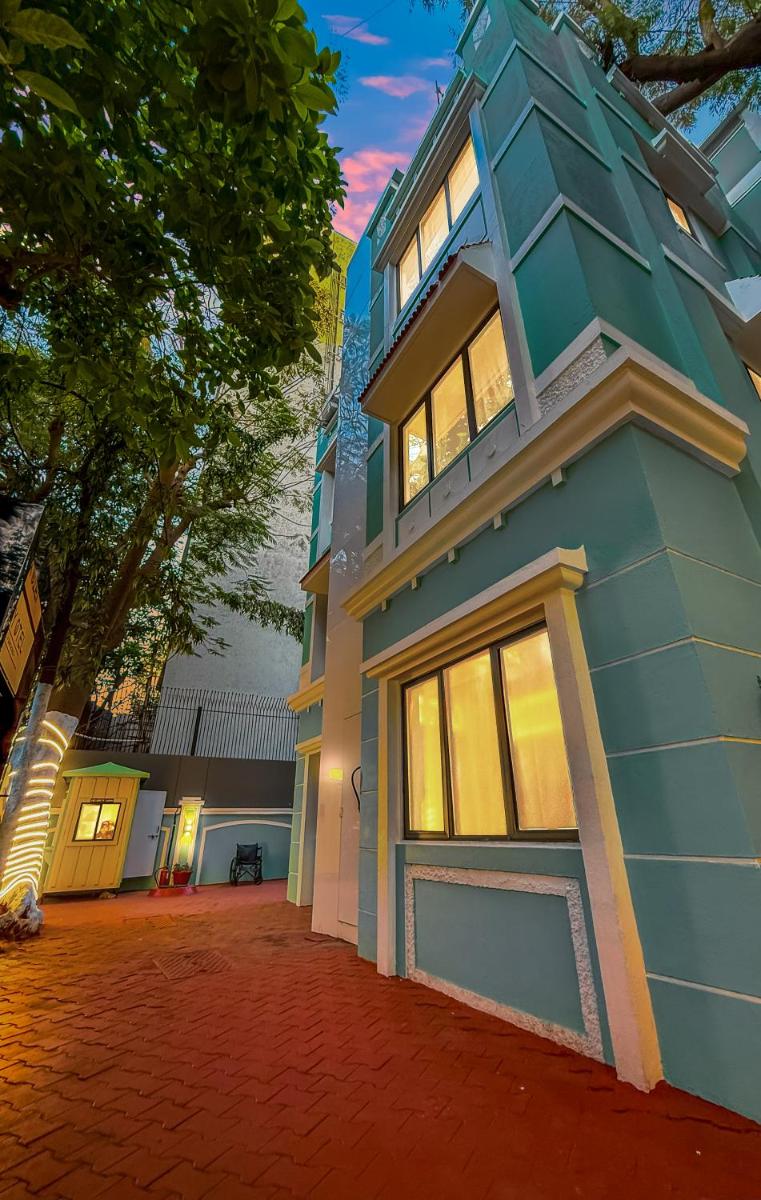 a blue building with windows on the side of it at MyOtel - Santacruz in Mumbai