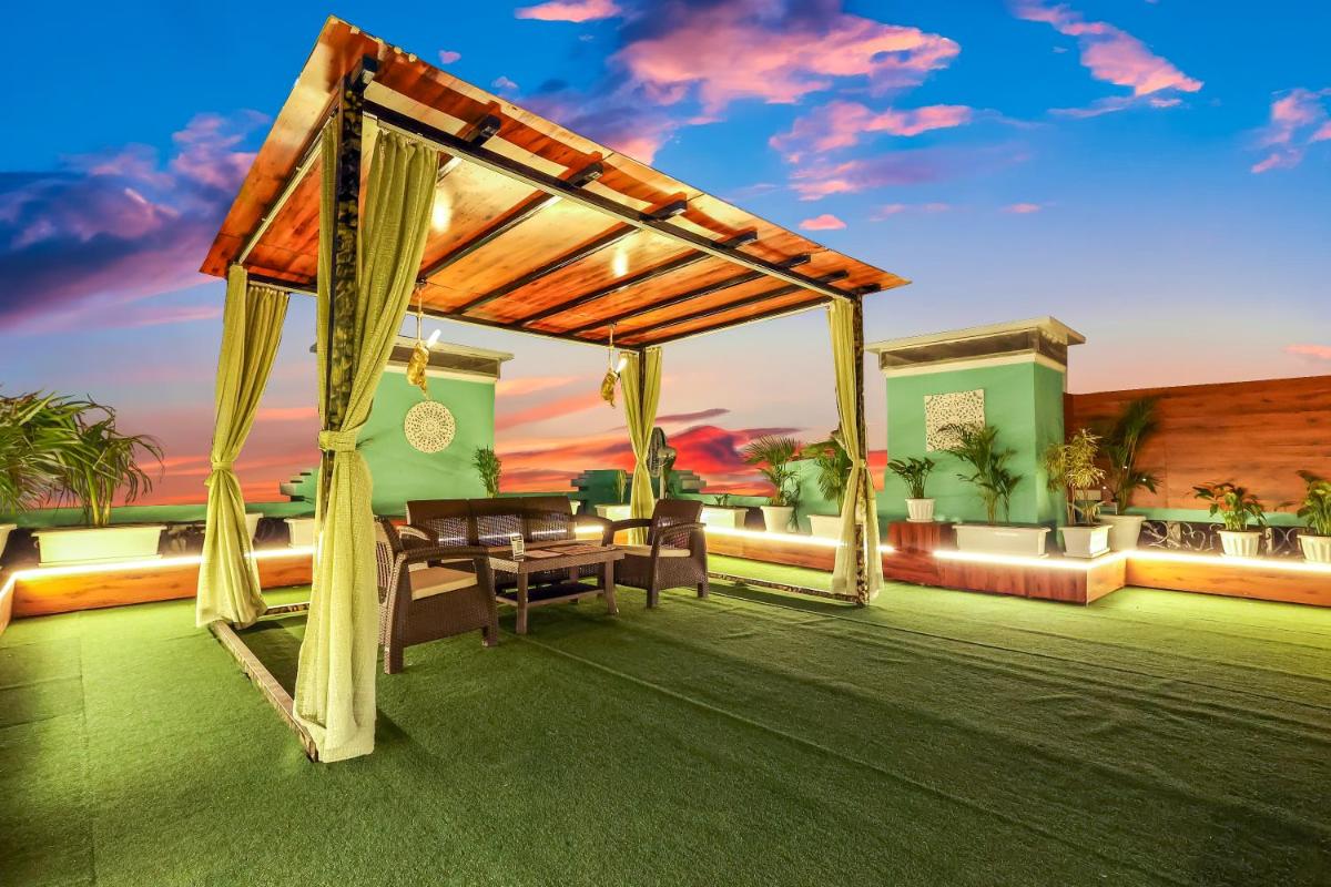 a patio with a tent and a table and chairs at MyOtel - Santacruz in Mumbai