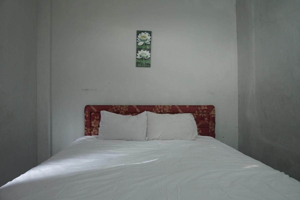Hotel O Losmen Arkansas Syariah - Housity