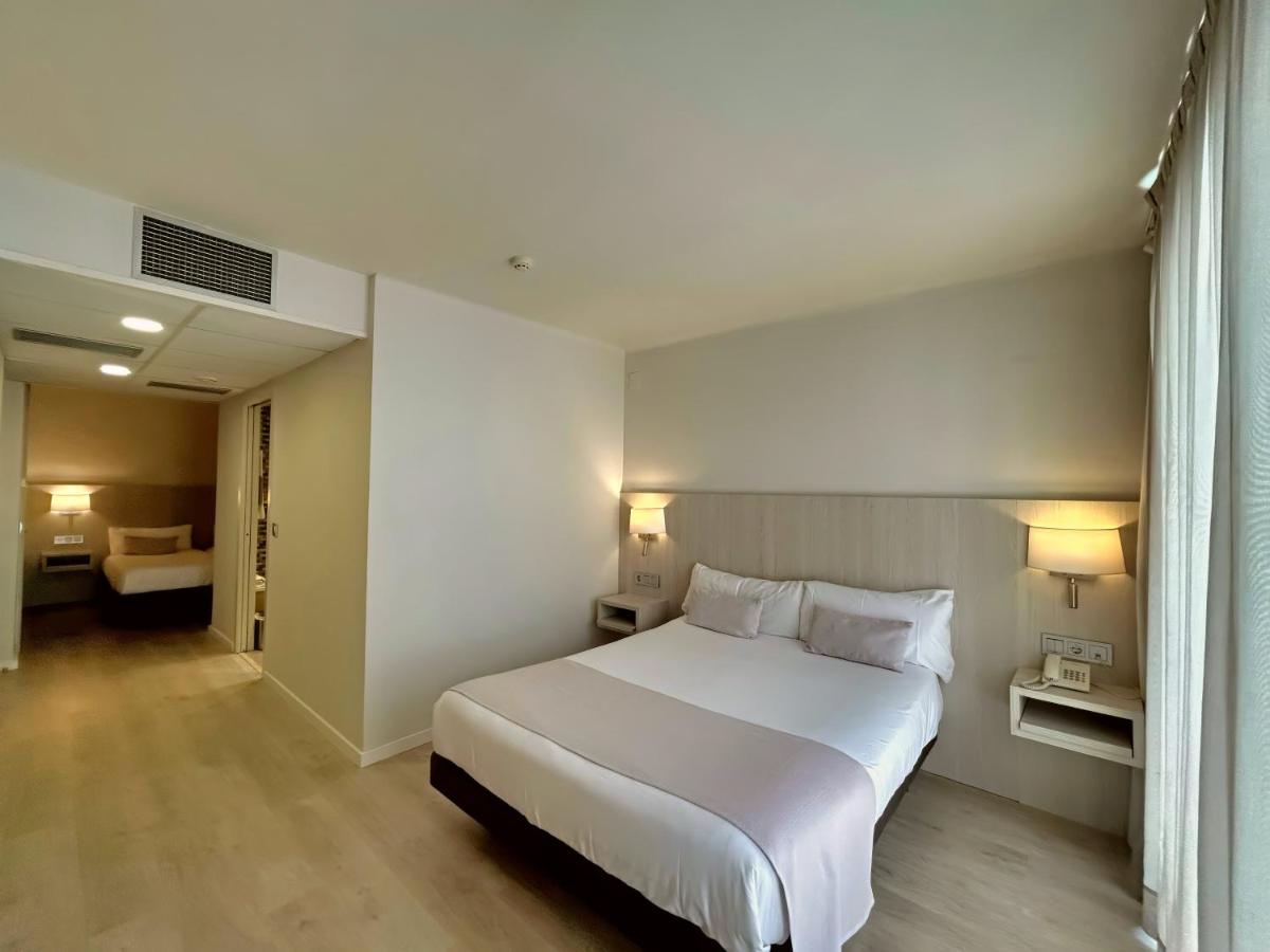 Cama o camas de una habitación en Hotel Marina