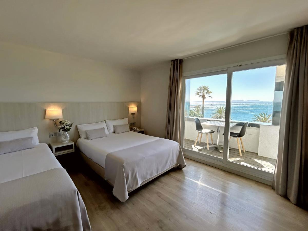 Cama o camas de una habitación en Hotel Marina