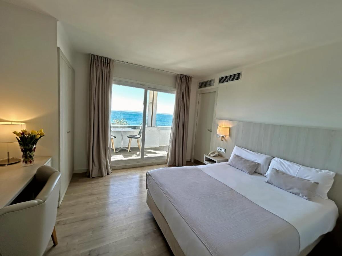 Cama o camas de una habitación en Hotel Marina