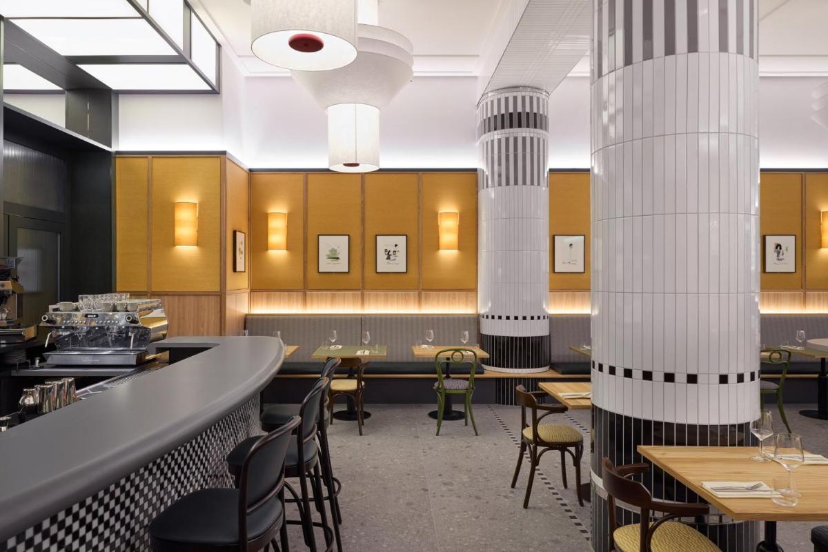 Ein Restaurant oder anderes Speiselokal in der Unterkunft Kimpton Main Frankfurt by IHG