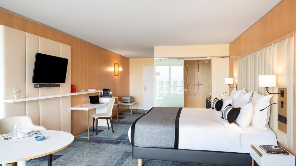 Télévision ou salle de divertissement dans l'établissement Residhome Suites Paris Sénart