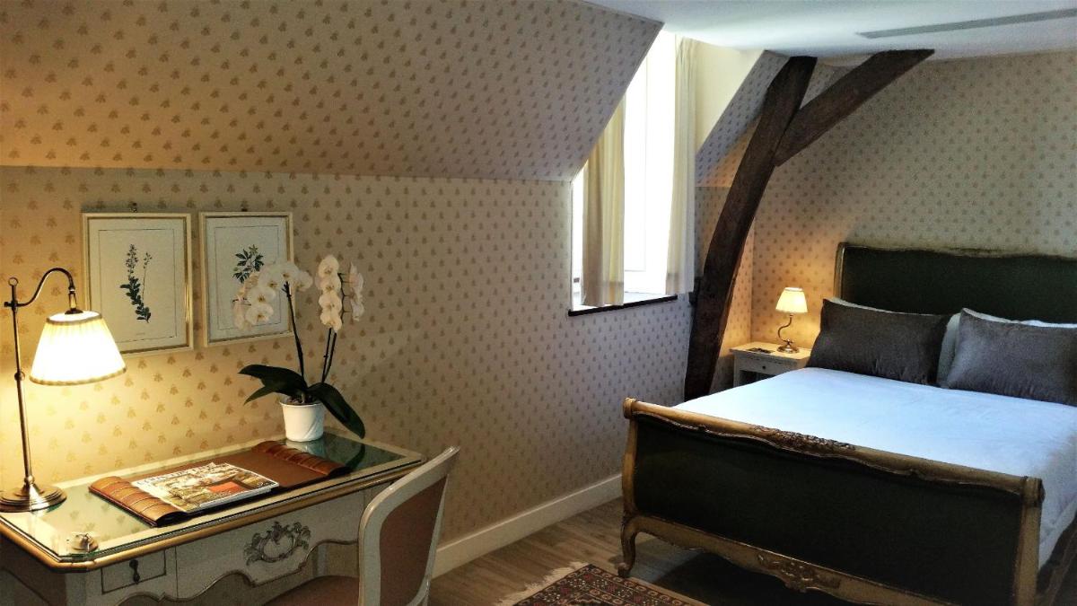 Un ou plusieurs lits dans un hébergement de l'établissement Château de Vault de Lugny