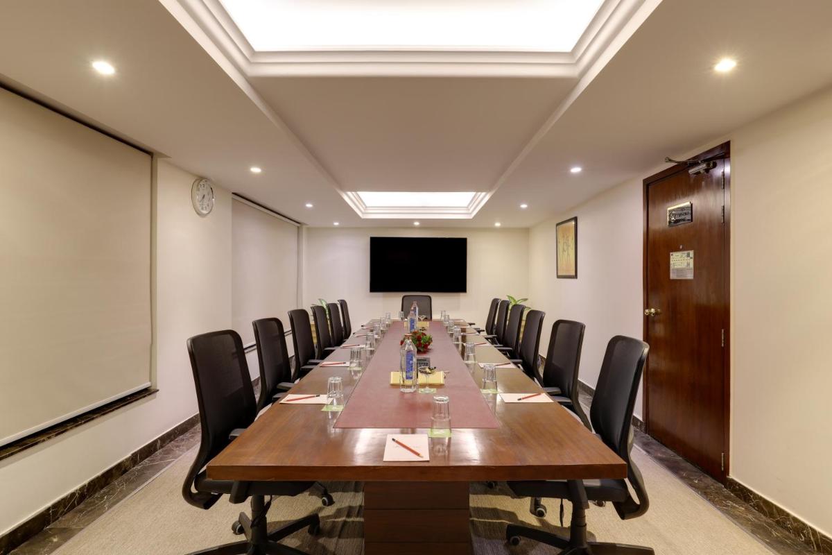a conference room with a long table and chairs at Saura Hotel, Agra - A Club Mahindra Associate in Agra
