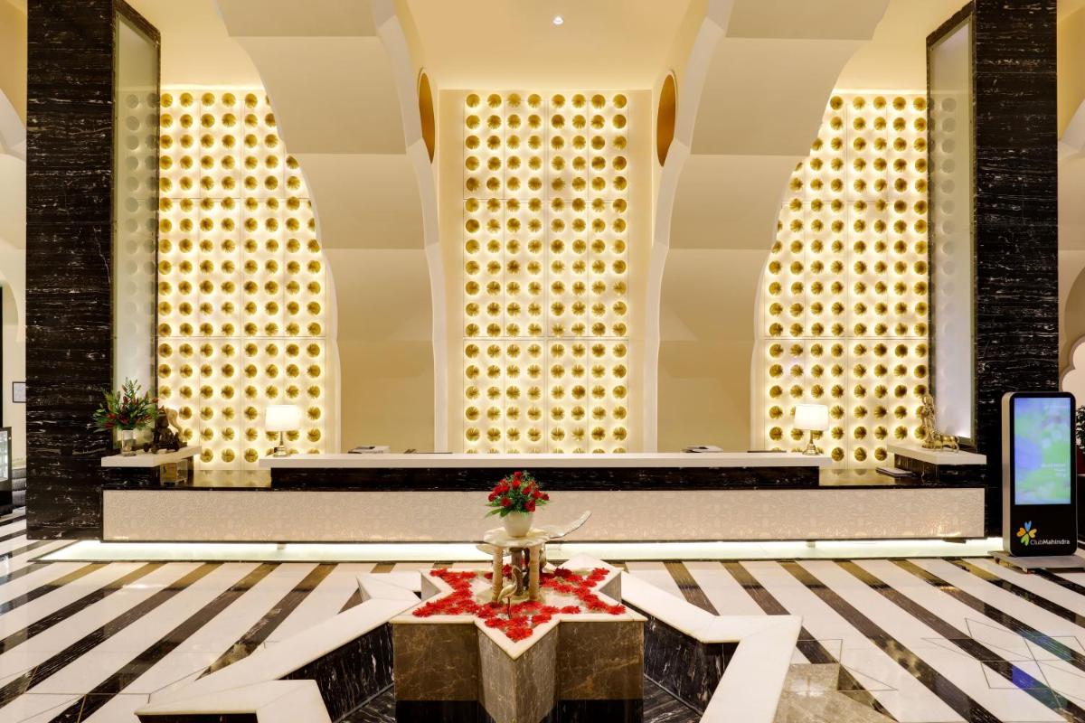 a lobby of a hotel with a table in the middle at Saura Hotel, Agra - A Club Mahindra Associate in Agra