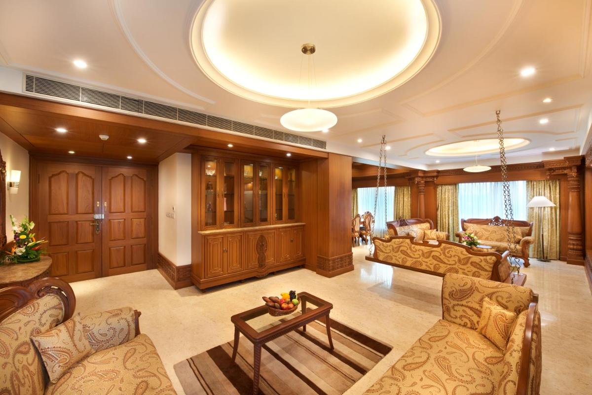 a large living room with couches and a table at Accord Puducherry in Puducherry