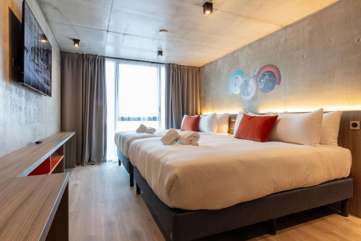 Un ou plusieurs lits dans un hébergement de l'établissement Ki Space Hotel & Spa - near Disneyland Paris