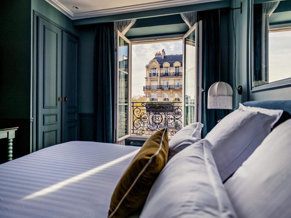 Un ou plusieurs lits dans un hébergement de l'établissement Hotel Duquesne Eiffel