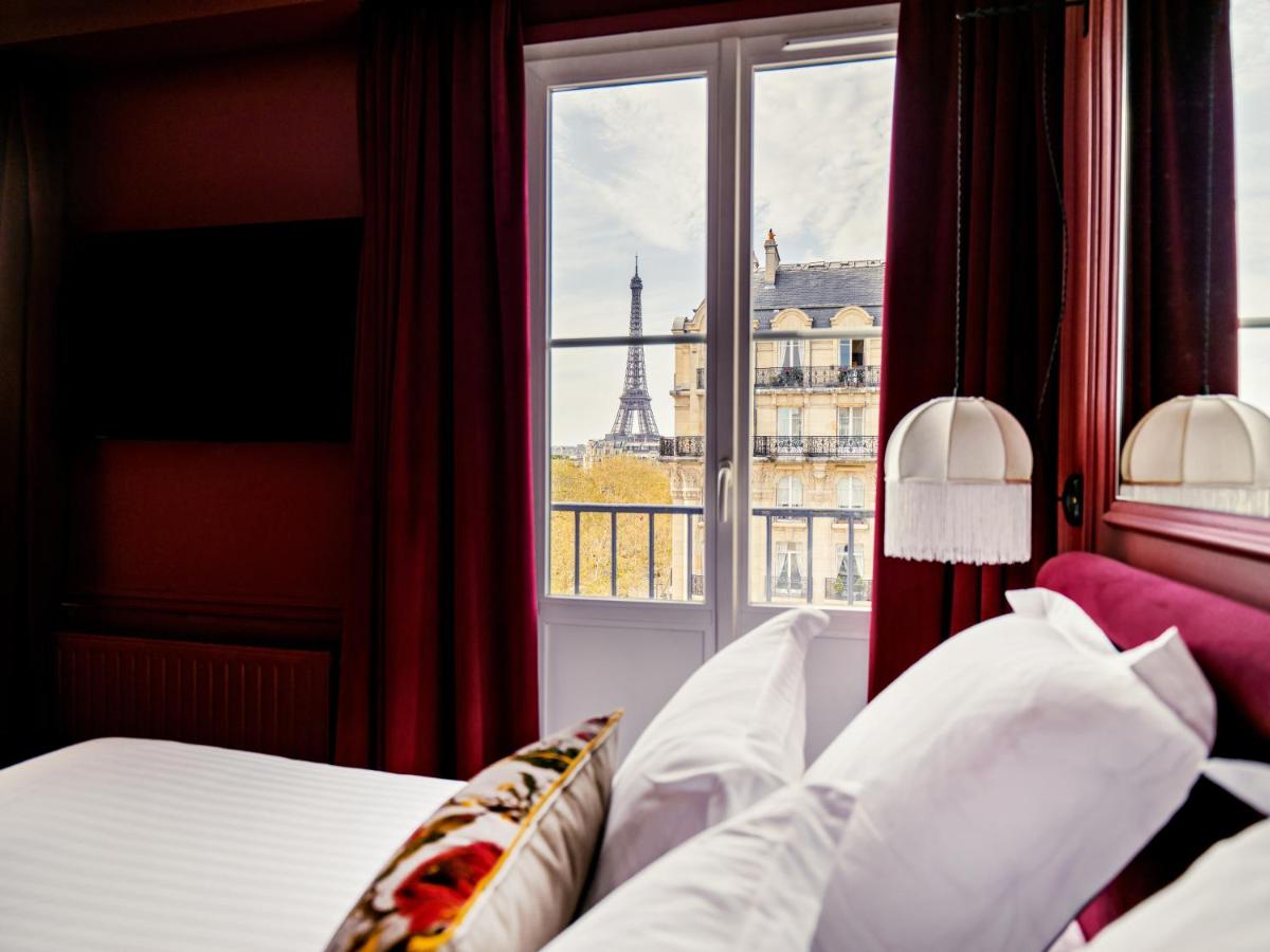 Un ou plusieurs lits dans un hébergement de l'établissement Hotel Duquesne Eiffel
