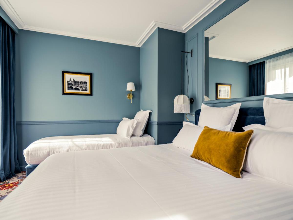 Un ou plusieurs lits dans un hébergement de l'établissement Hotel Duquesne Eiffel