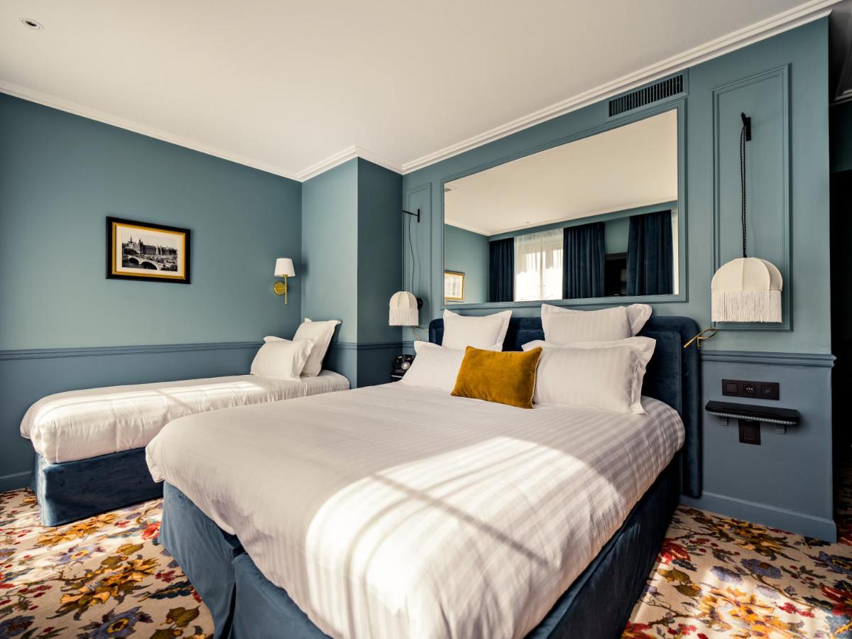 Un ou plusieurs lits dans un hébergement de l'établissement Hotel Duquesne Eiffel