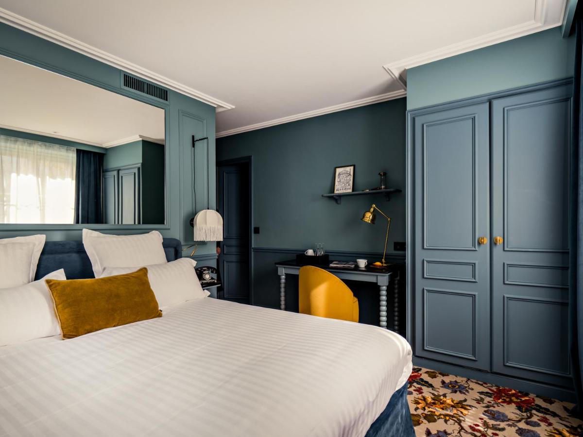 Un ou plusieurs lits dans un hébergement de l'établissement Hotel Duquesne Eiffel