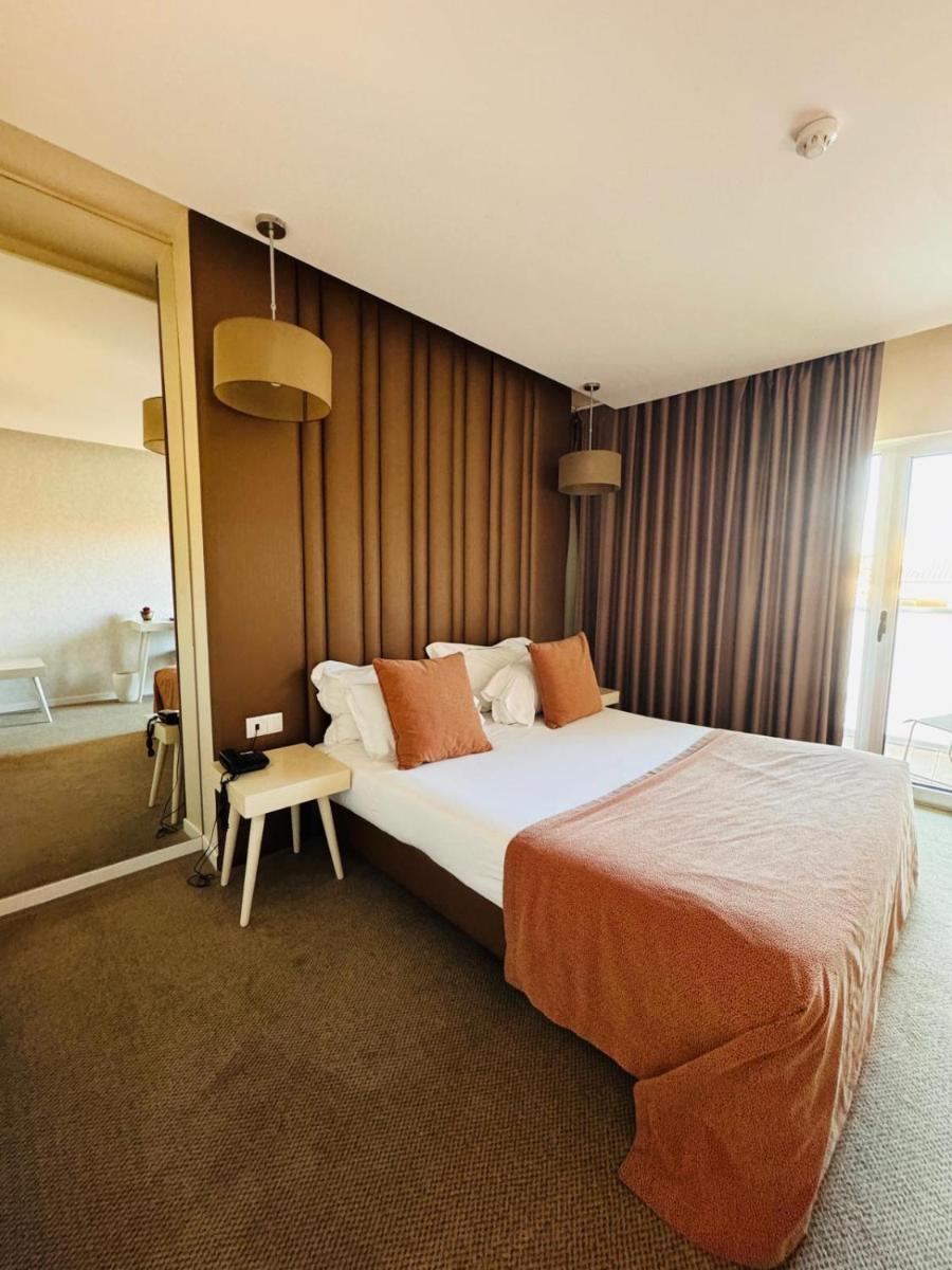 Uma cama ou camas num quarto em Hotel de Ilhavo Plaza & Spa