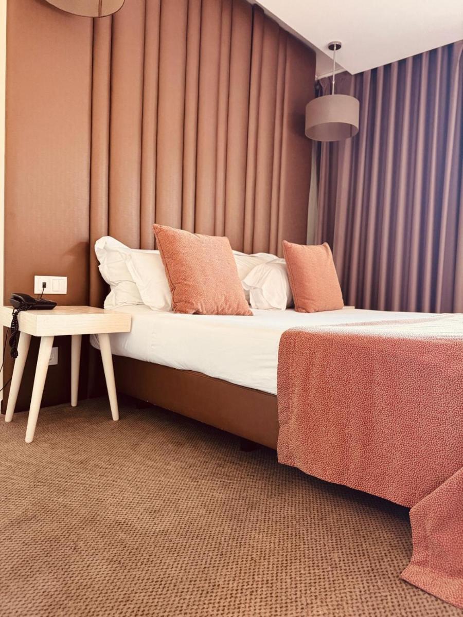 Uma cama ou camas num quarto em Hotel de Ilhavo Plaza & Spa