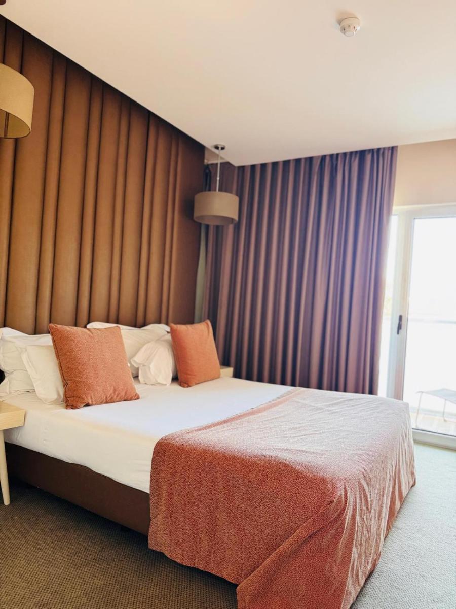 Uma cama ou camas num quarto em Hotel de Ilhavo Plaza & Spa