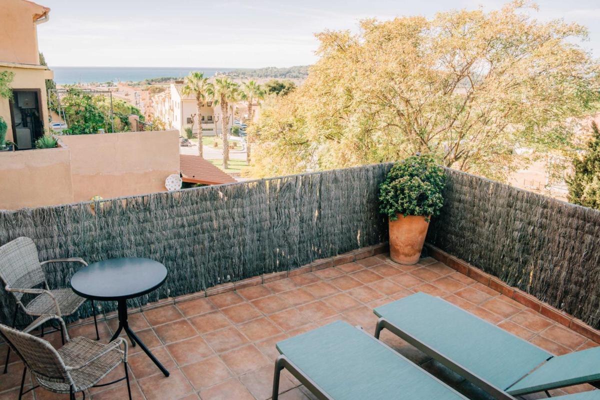 Un balcón o terraza de Gran Claustre Boutique Hotel