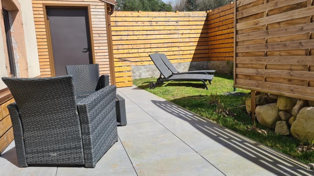 Jardin de l'établissement Domaine du Haut Jardin Hôtel & Chalets Spa Privé