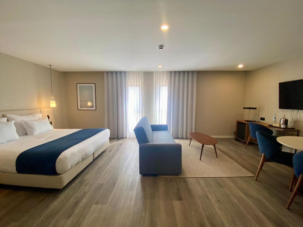 Uma cama ou camas num quarto em AP Sines - Costa Alentejana