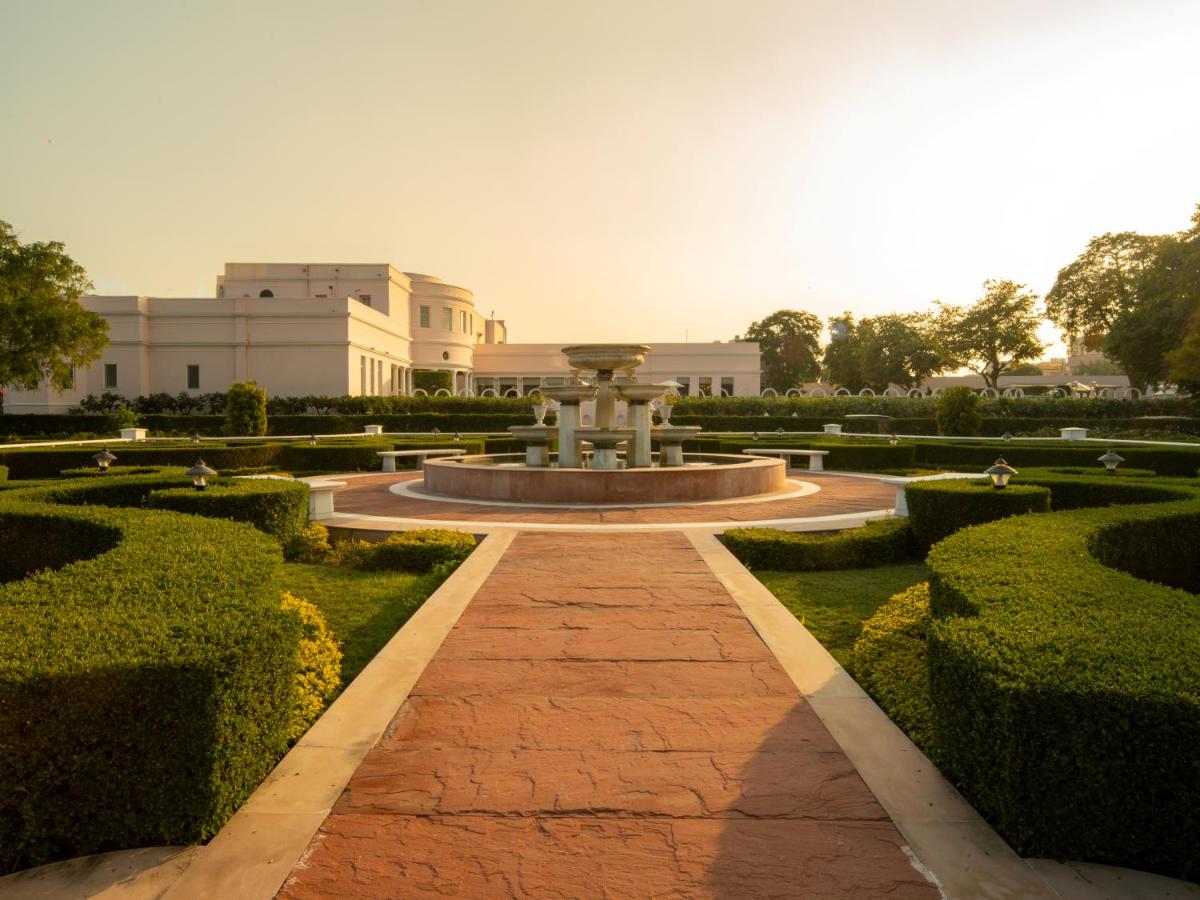 a fountain in the middle of a garden at Rajmahal Palace RAAS in Jaipur
