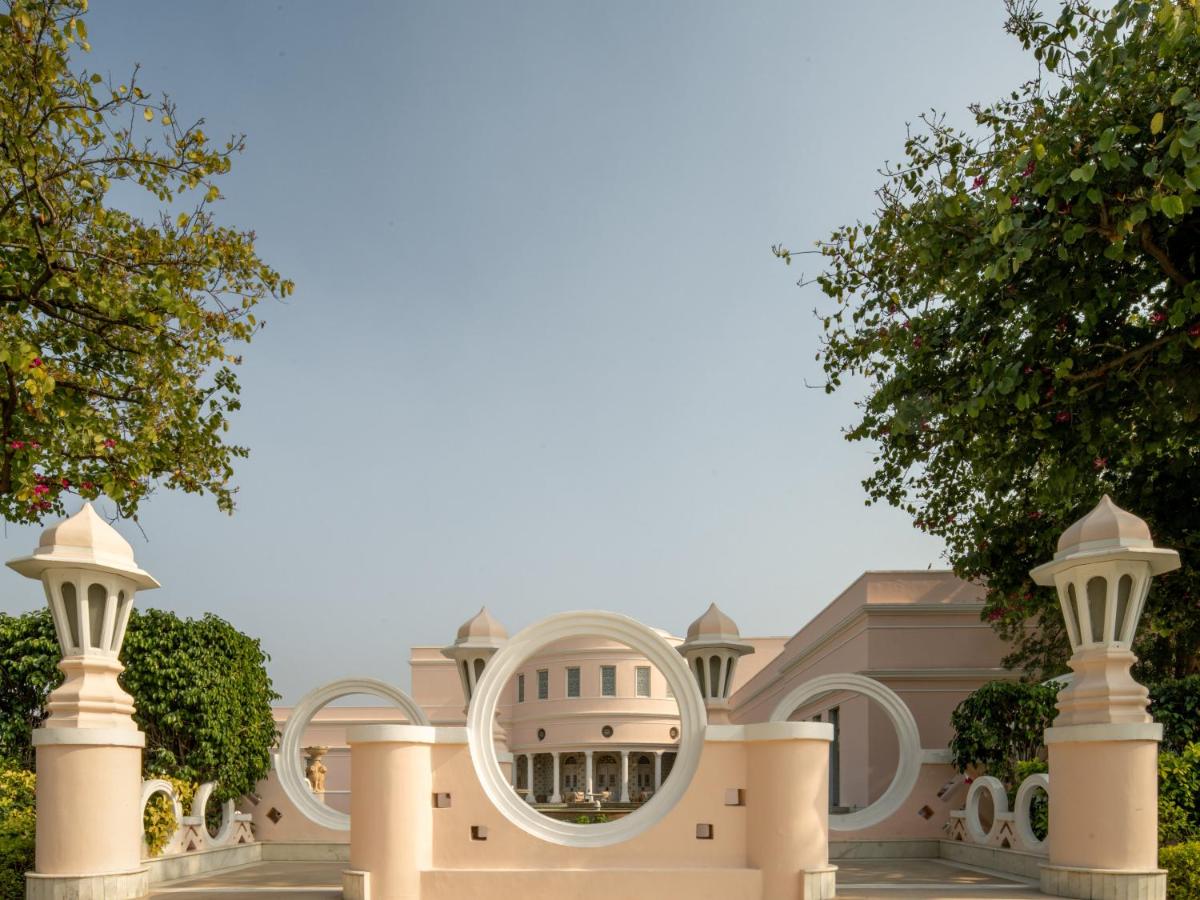 a house with a mirror on the front of it at Rajmahal Palace RAAS in Jaipur