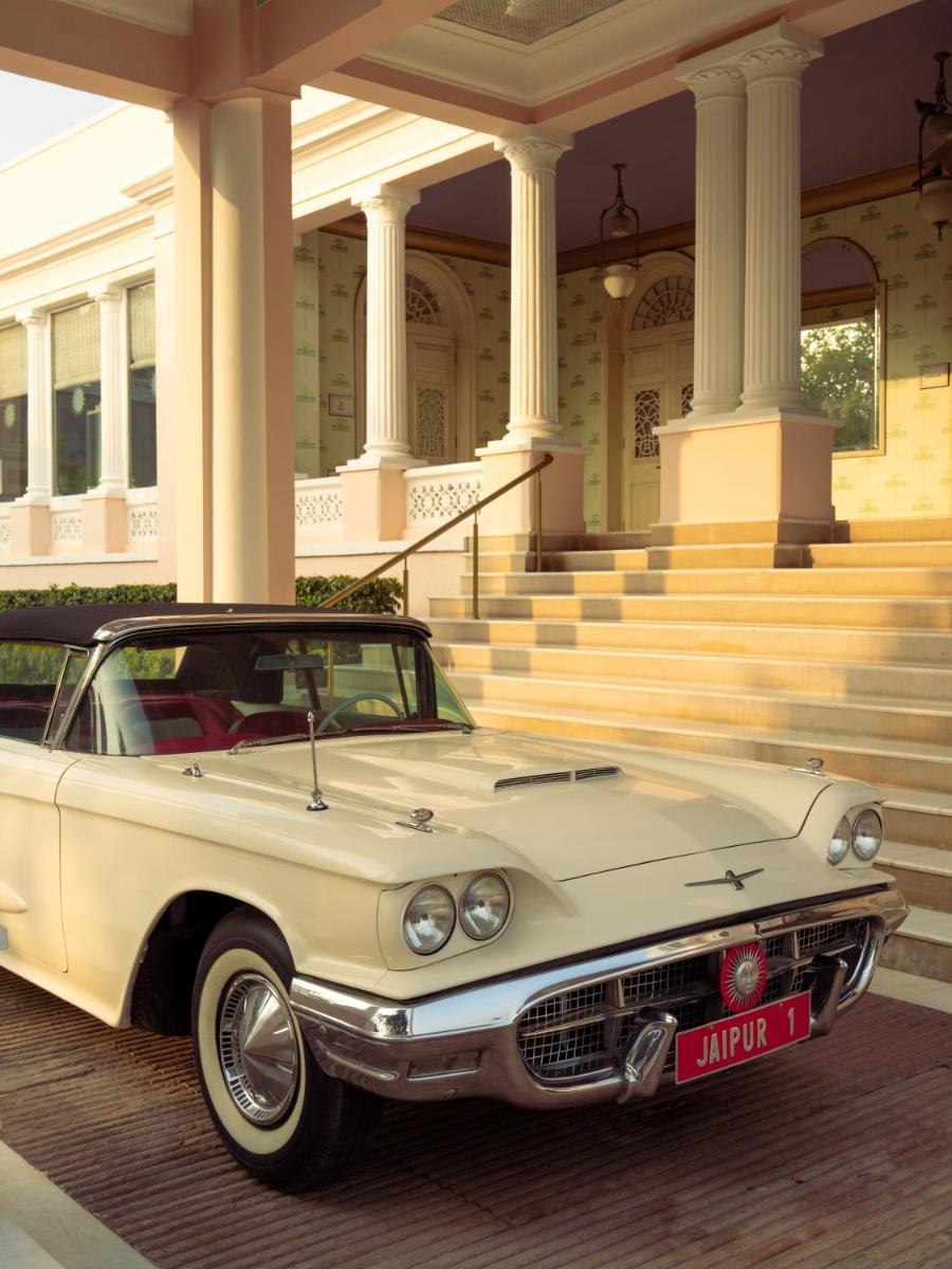a white car parked in front of a mansion at Rajmahal Palace RAAS in Jaipur