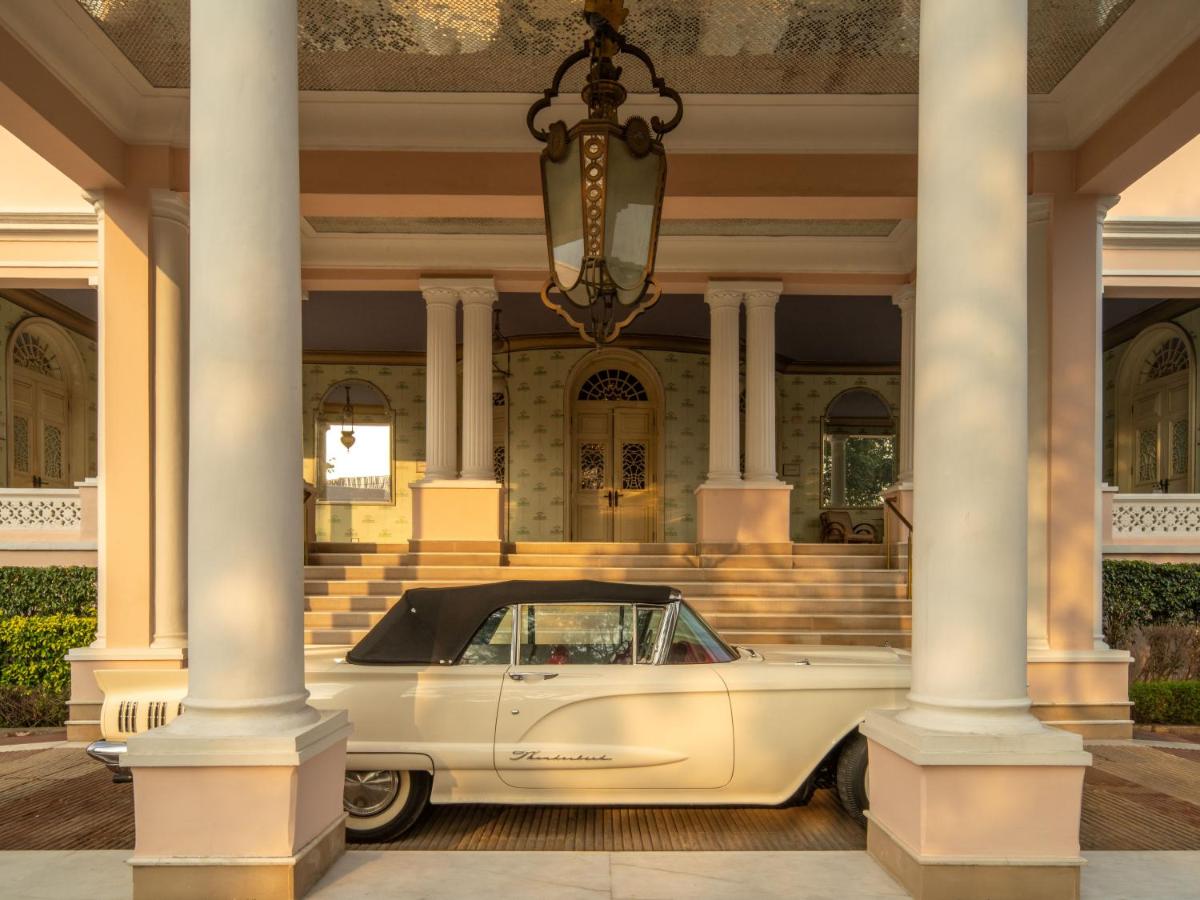 a white car parked in front of a building at Rajmahal Palace RAAS in Jaipur