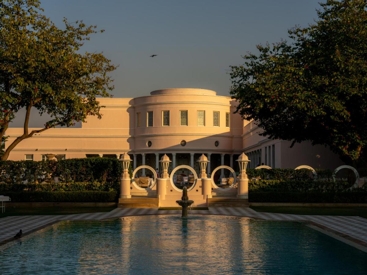 a building with a fountain in front of it at Rajmahal Palace RAAS in Jaipur