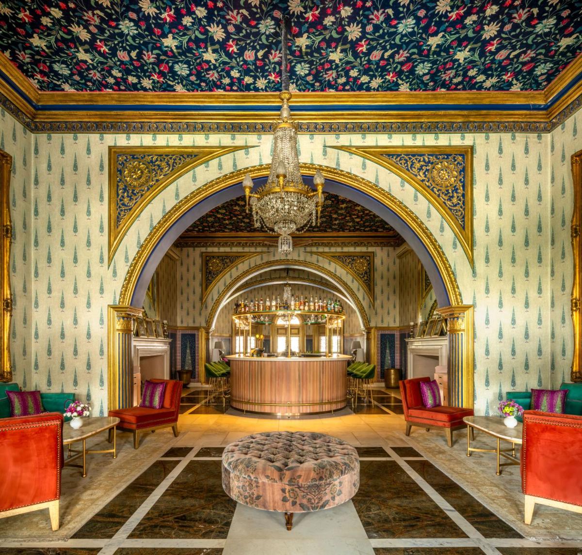 a large room with a bar with a ceiling at Rajmahal Palace RAAS in Jaipur