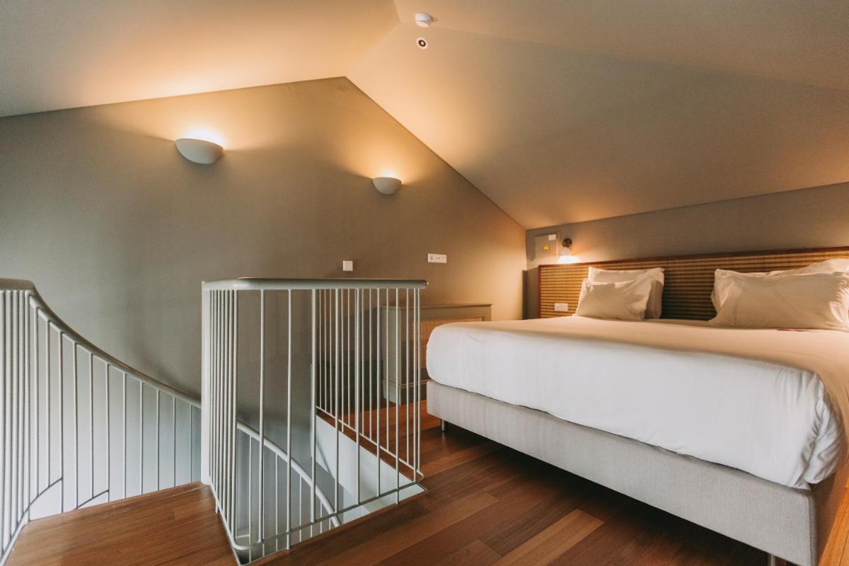 Uma cama ou camas num quarto em Torel Saboaria