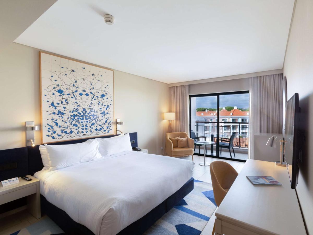 Uma cama ou camas num quarto em Hilton Vilamoura