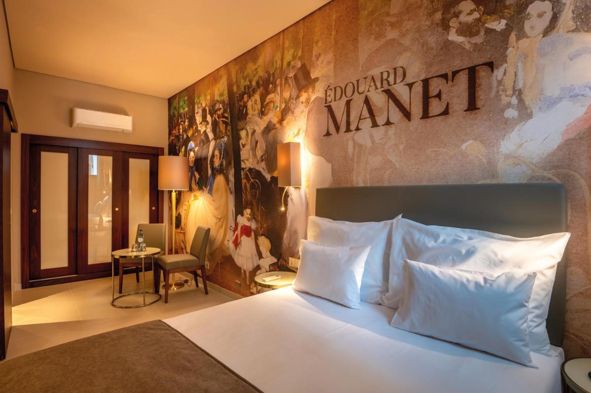 Uma cama ou camas num quarto em Vila Gale Collection Elvas