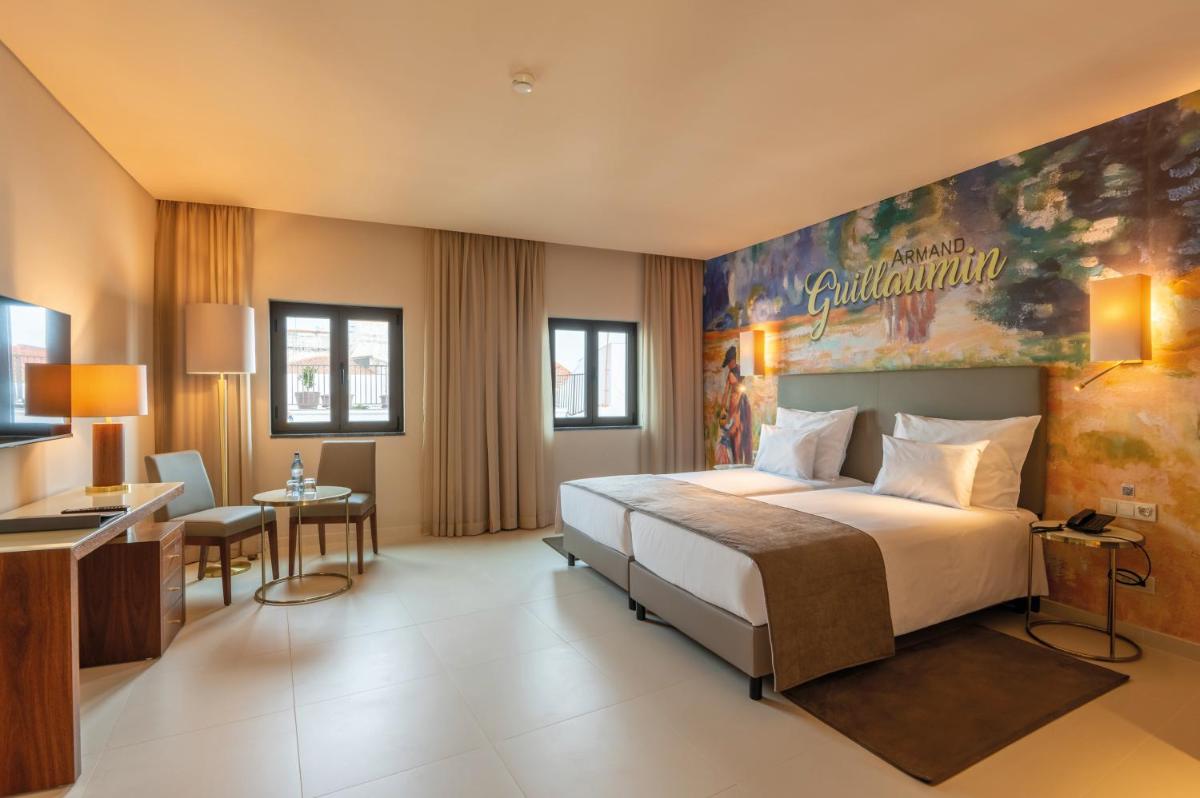 Uma cama ou camas num quarto em Vila Gale Collection Elvas