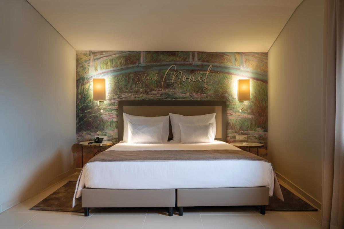 Uma cama ou camas num quarto em Vila Gale Collection Elvas