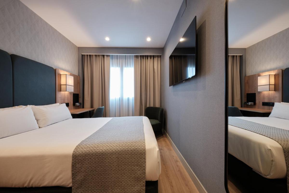 Cama o camas de una habitación en Catalonia La Maquinista