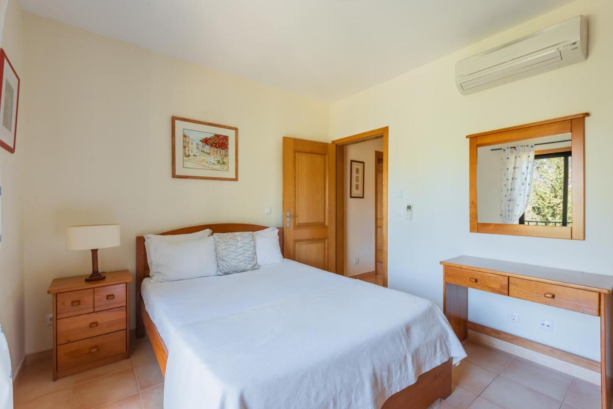 Uma cama ou camas num quarto em Estrela da Luz Resort