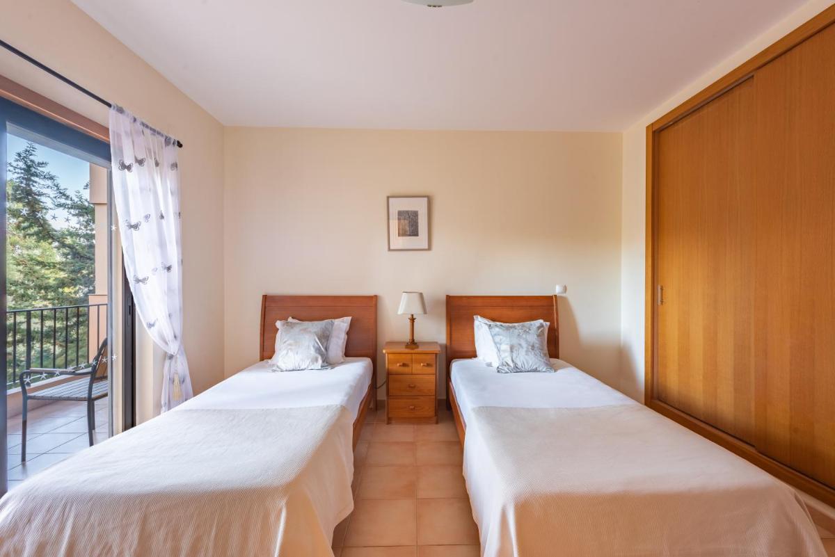 Uma cama ou camas num quarto em Estrela da Luz Resort