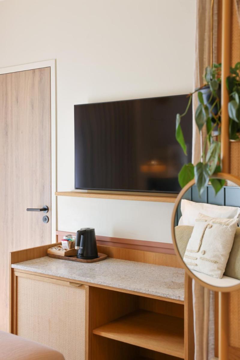 Télévision ou salle de divertissement dans l'établissement Bloom House Hôtel & SPA