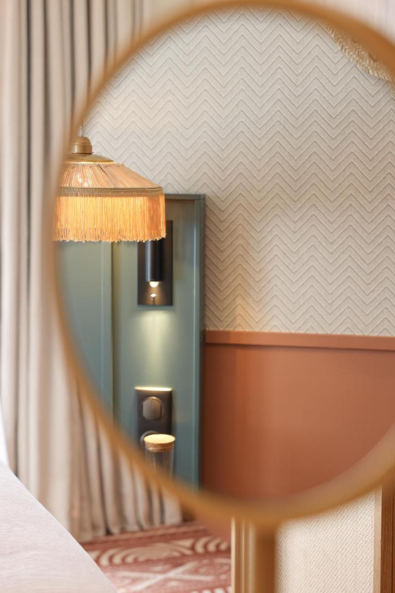 Un ou plusieurs lits dans un hébergement de l'établissement Bloom House Hôtel & SPA