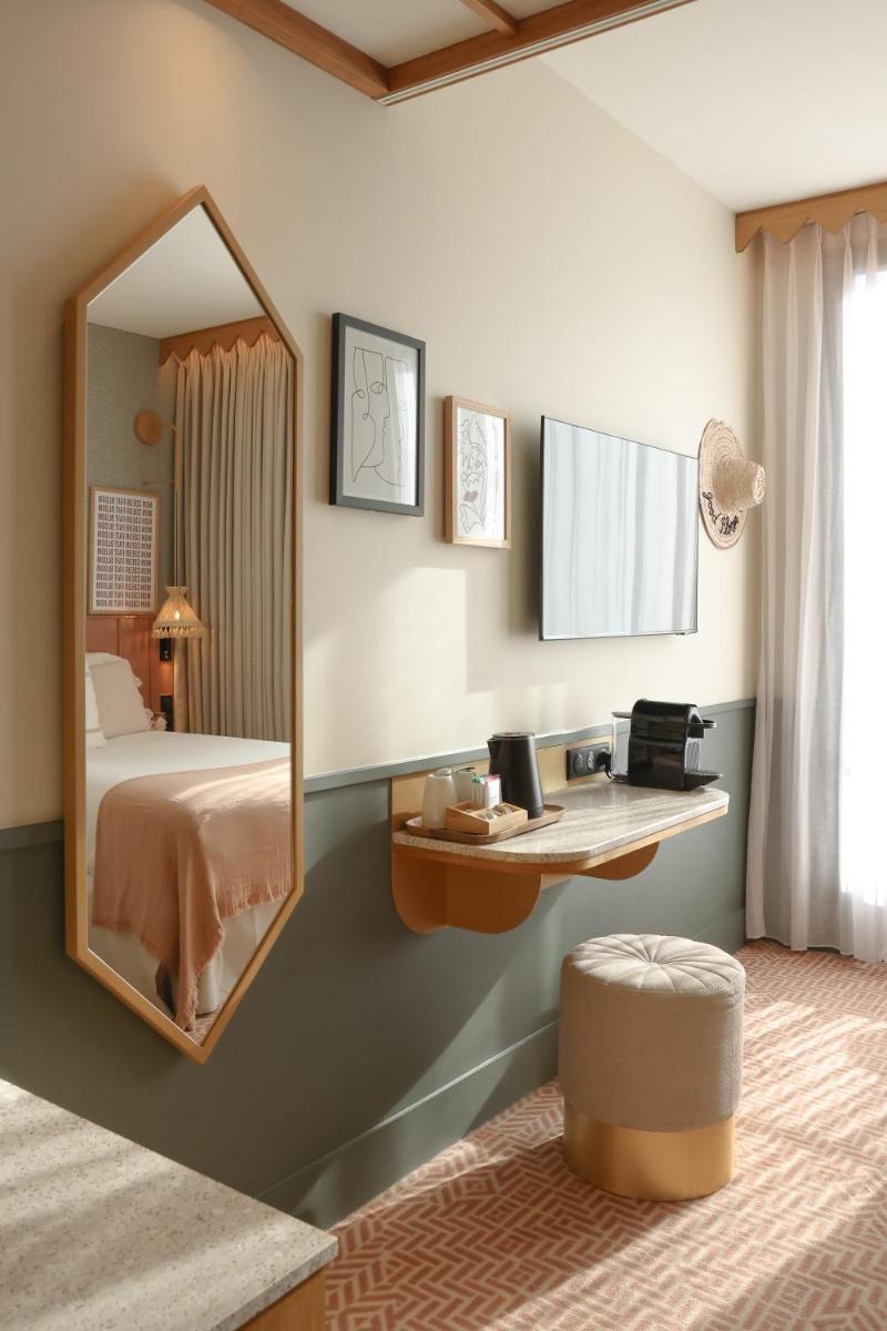 Un ou plusieurs lits dans un hébergement de l'établissement Bloom House Hôtel & SPA