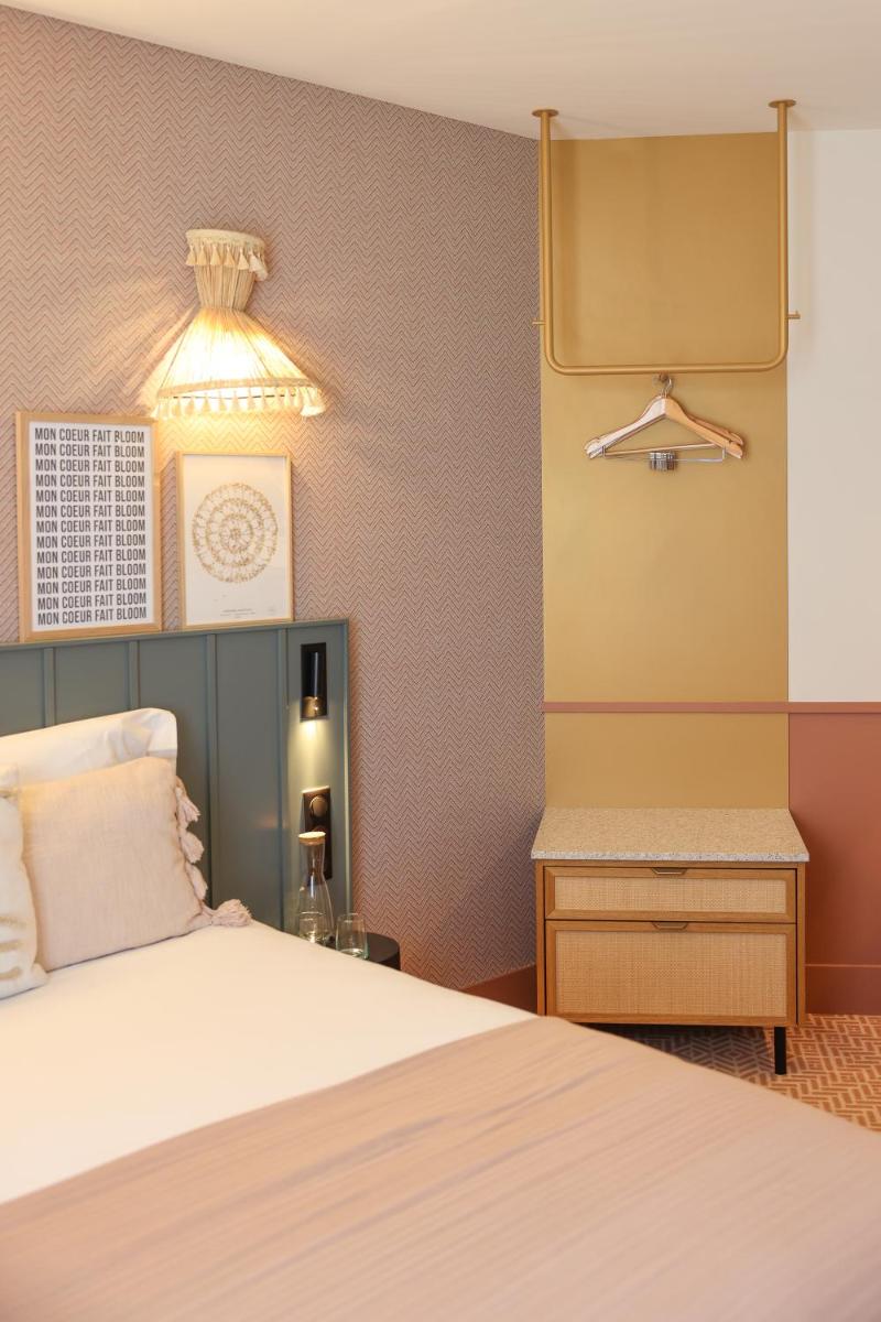 Un ou plusieurs lits dans un hébergement de l'établissement Bloom House Hôtel & SPA