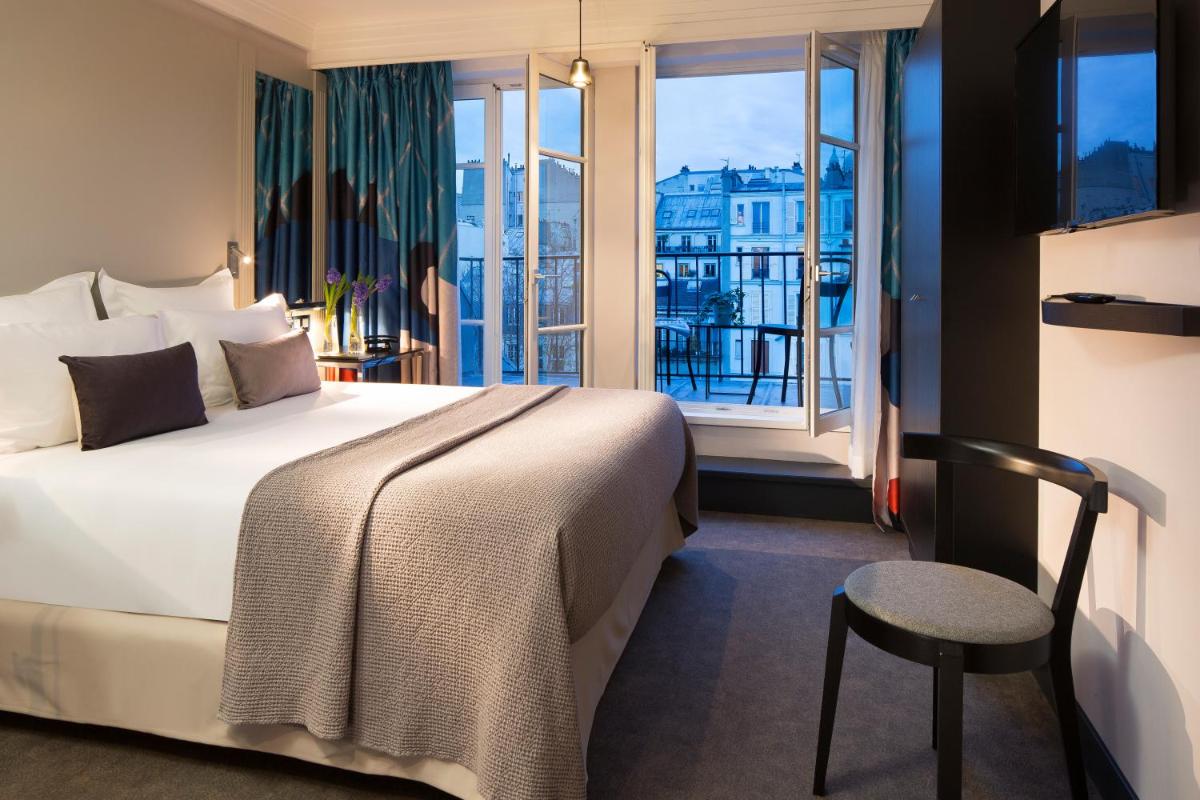 Un ou plusieurs lits dans un hébergement de l'établissement Les Matins de Paris & Spa